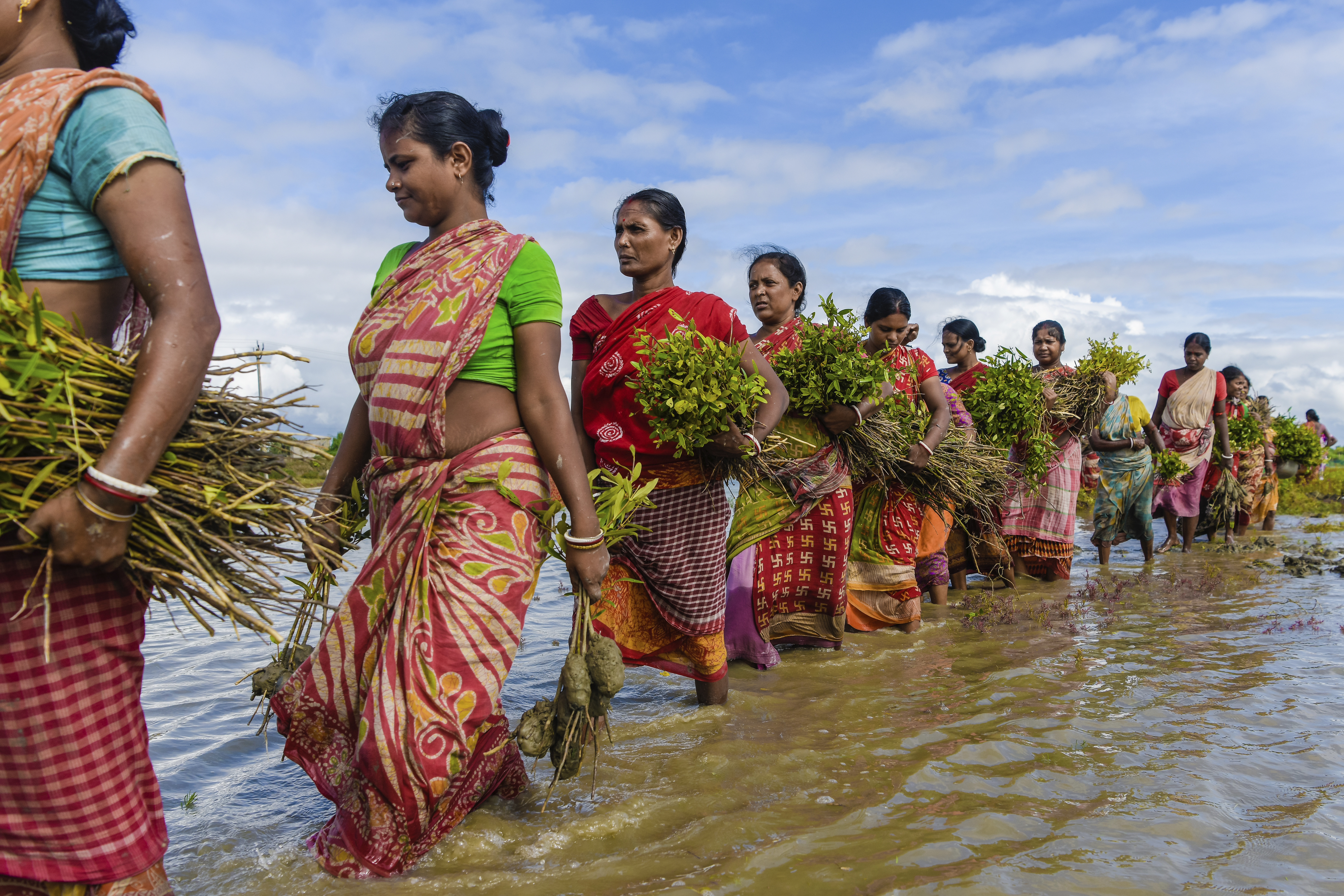 Women carrying water India